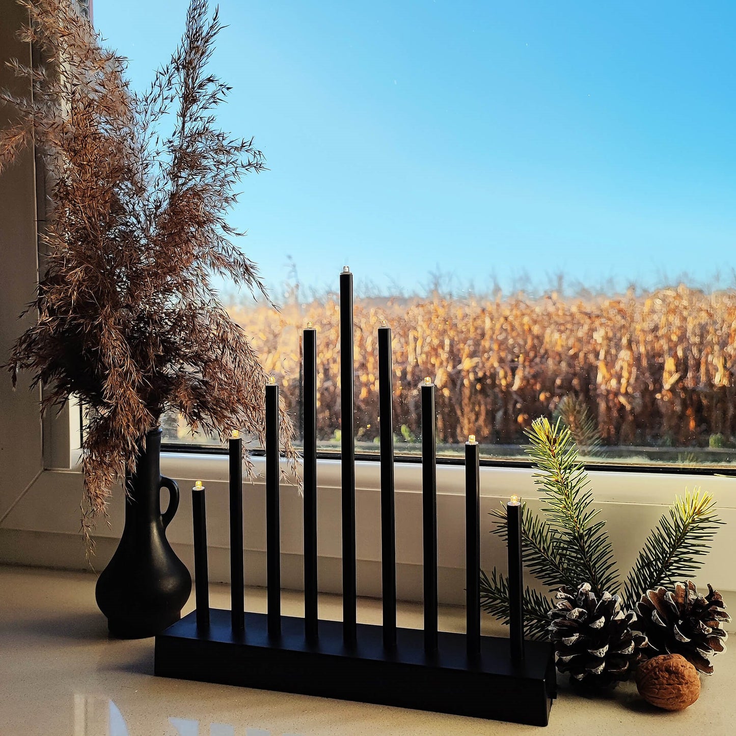 CL0854 Derokatyvinis žvakių stovas 9 LED