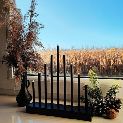 CL0854 Derokatyvinis žvakių stovas 9 LED